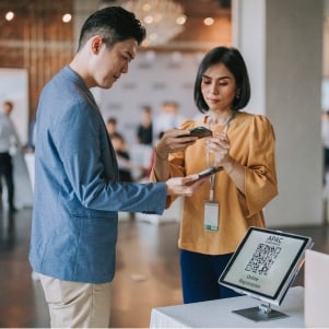 A couple screening a QR code